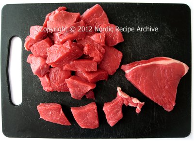Cutting meat for grinding