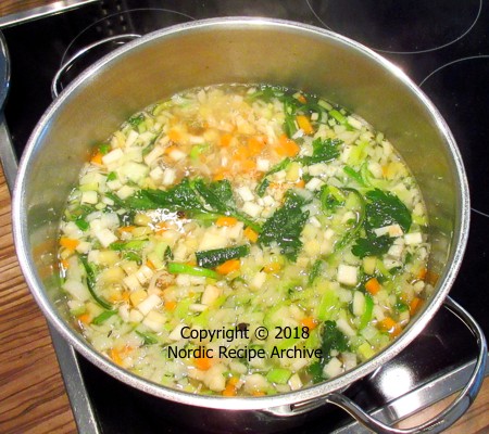 Vegetable stock ingredients in saucepan